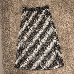High waisted skirt. Hits down to mid calf. Size M